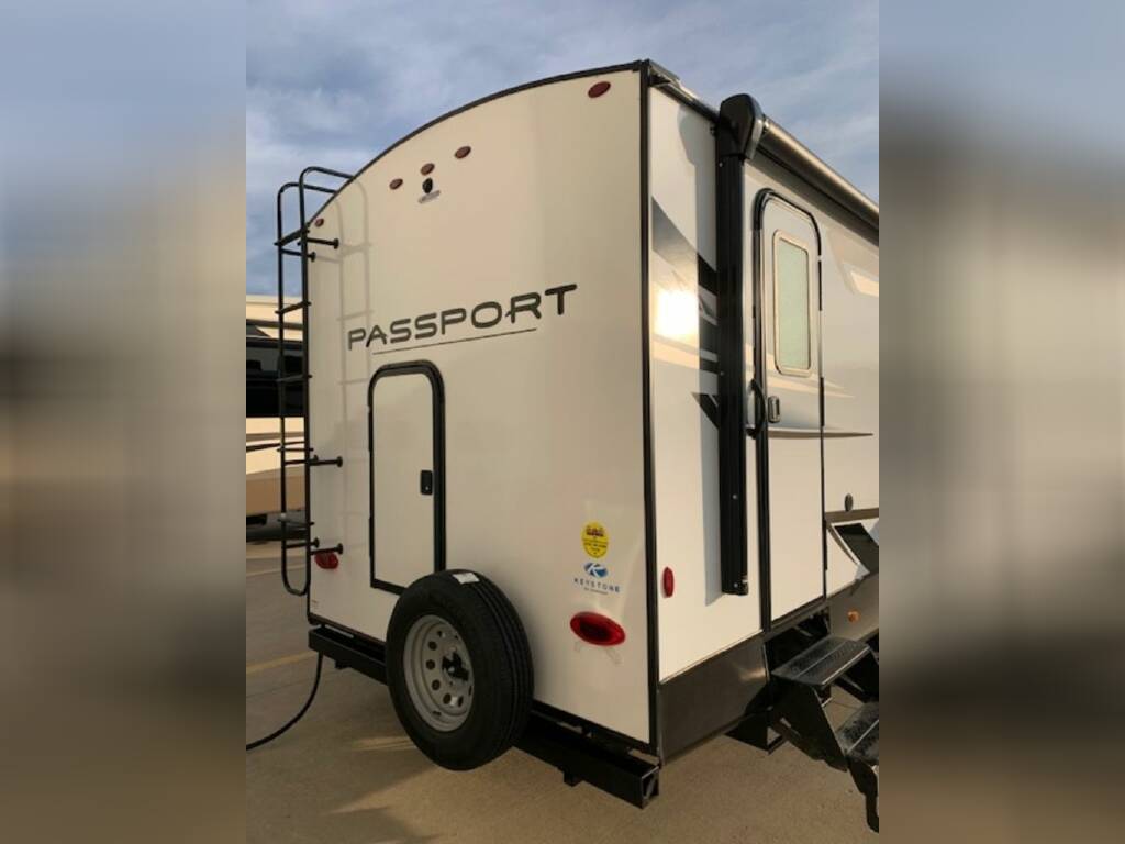 Rear view of the New 2023 Keystone Rv Passport GT 2951BH Travel Trailer RV.