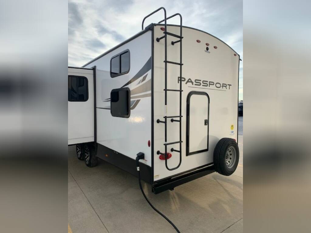 Rear view of the New 2023 Keystone Rv Passport GT 2951BH Travel Trailer RV.