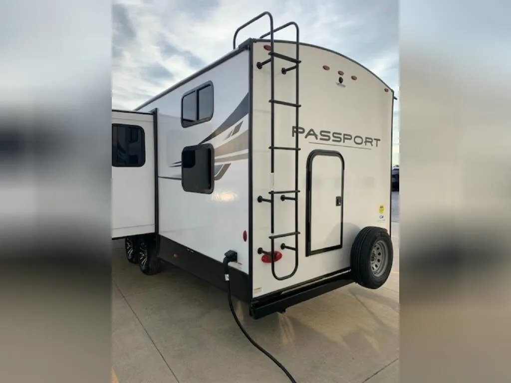 Rear view of the New 2023 Keystone Rv Passport GT 2951BH Travel Trailer RV.