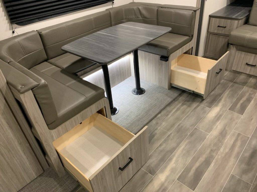 Dinette with drawers underneath the chairs.