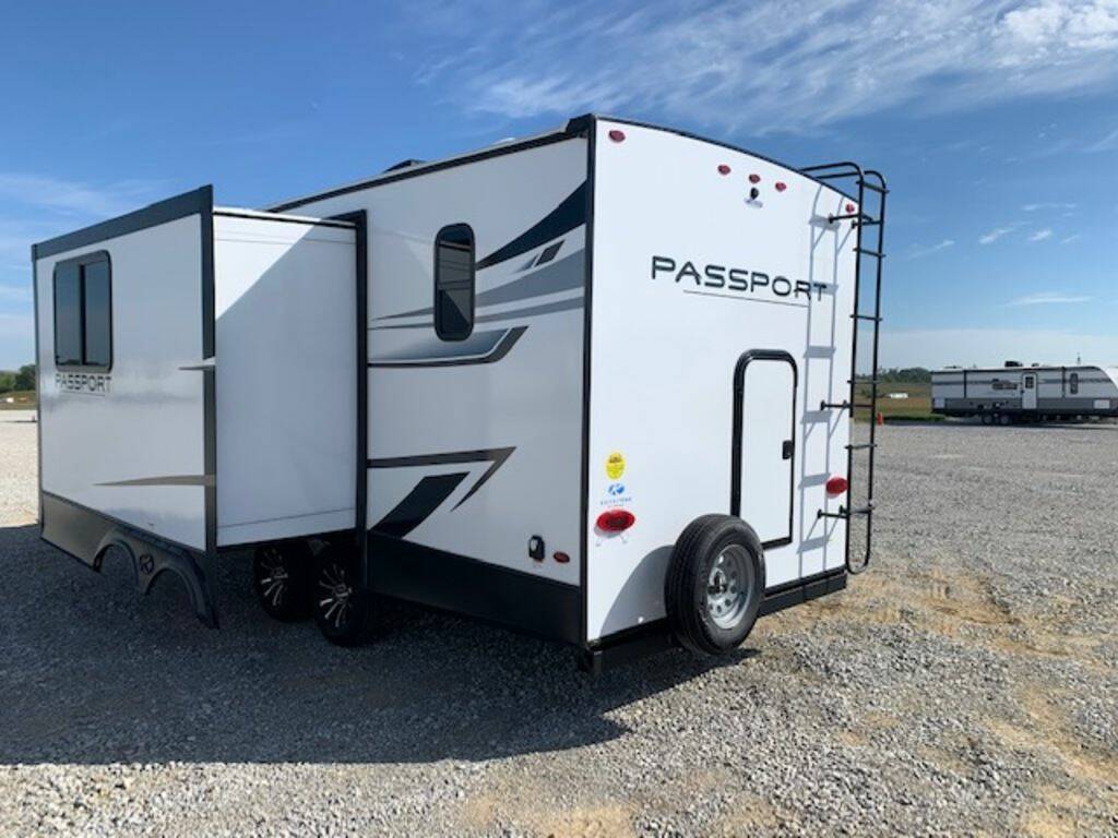 Rear view of the New 2023 Keystone Rv Passport SL 221BH Travel Trailer RV.