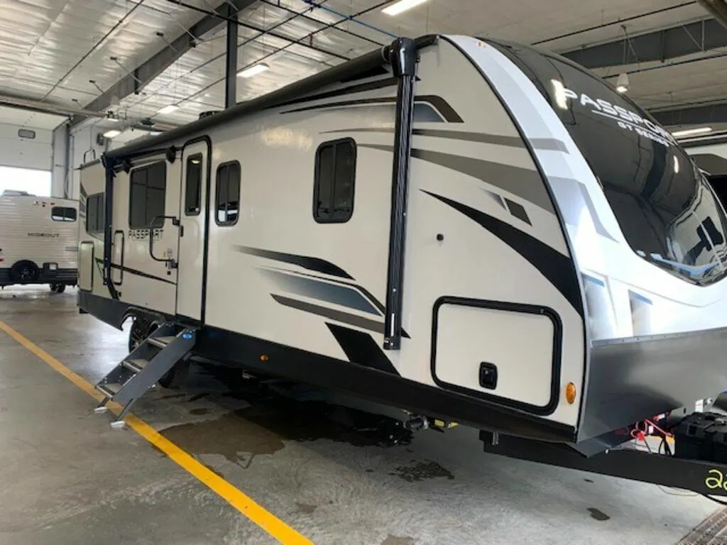 Side view of the New 2023 Keystone Rv Passport GT 2704RK Travel Trailer RV.