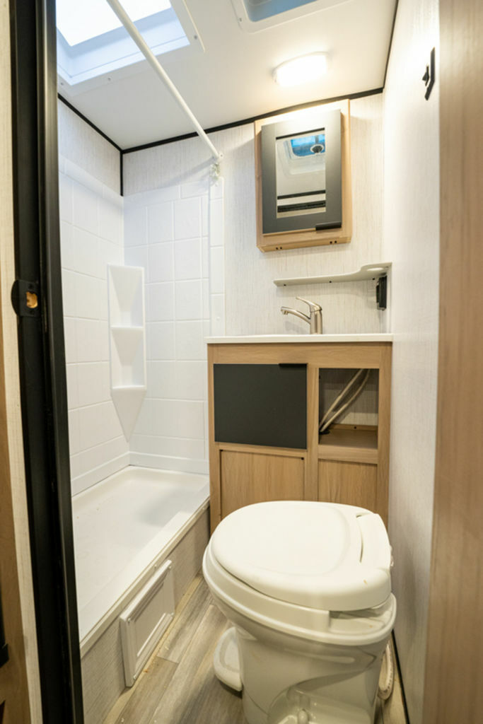 Bathroom with a sink, toilet and a shower.