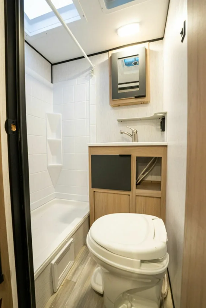 Bathroom with a sink, toilet and a shower.