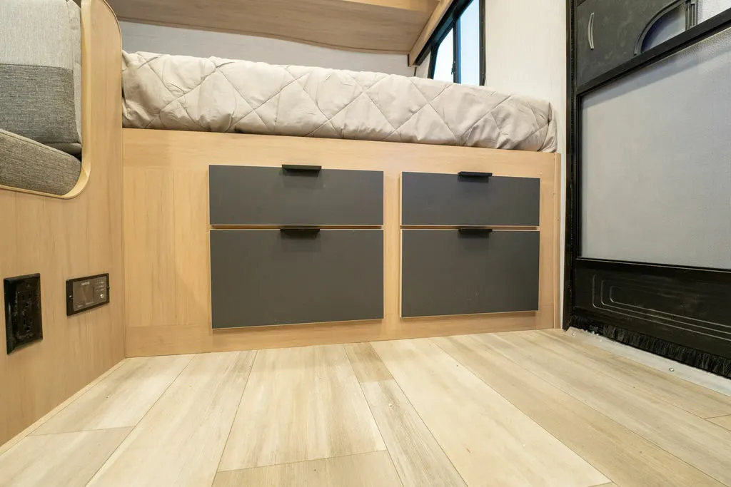 Bedroom with pull-out storage drawers.