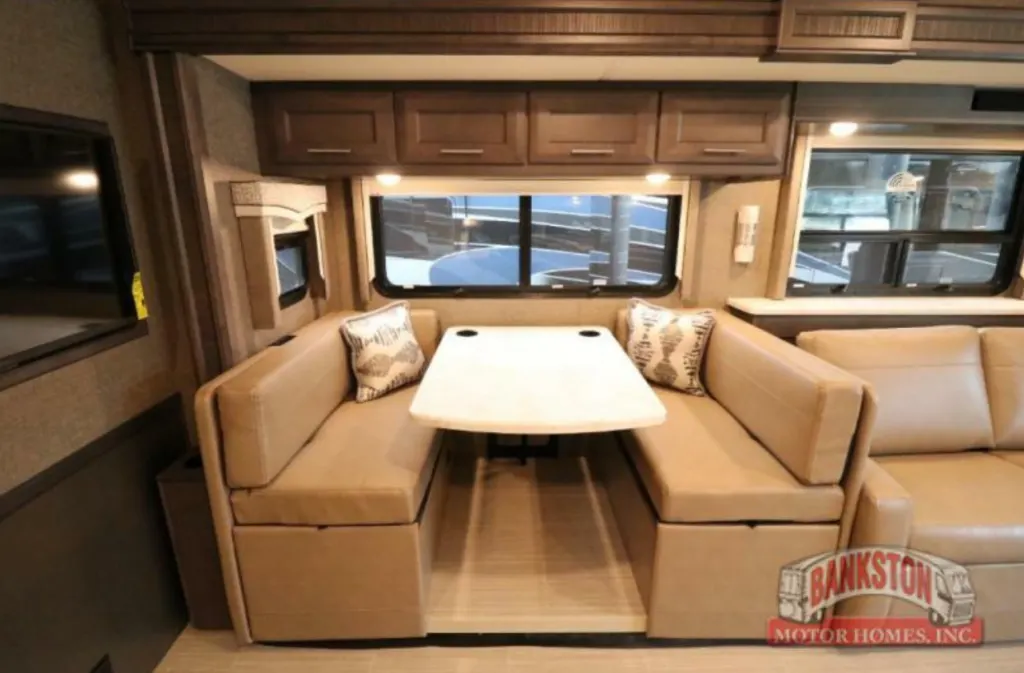 Dinette with overhead cabinets.