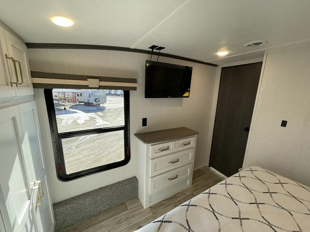 Bedroom with a TV and a dresser.