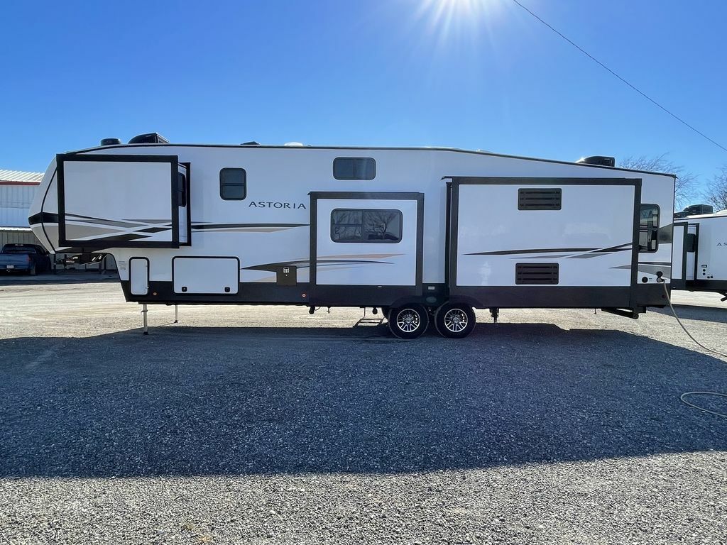 Side view of the New 2022 Dutchmen Astoria Platinum 3553MBP Fifth Wheel RV.