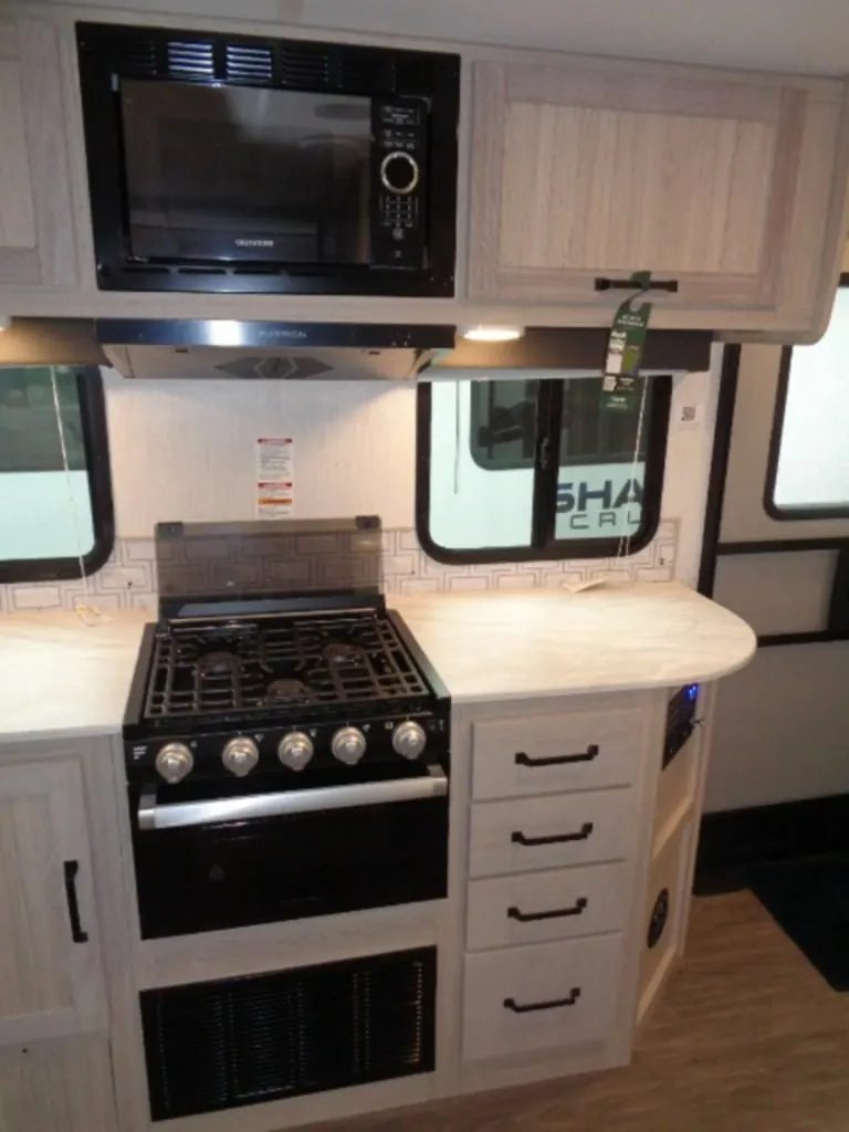 Kitchen with a gas burner, oven, and cabinets.