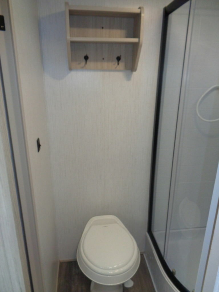 Bathroom with a toilet and a walk-in shower.