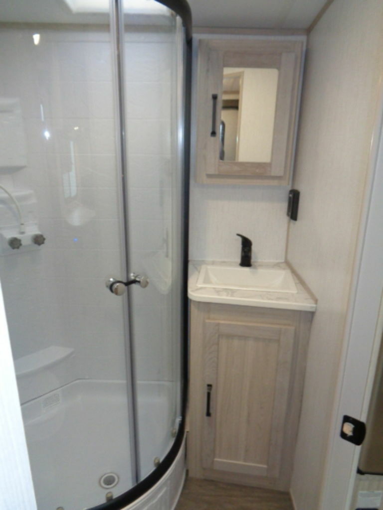 Bathroom with a sink and a walk-in shower.