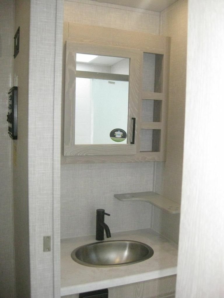 Bathroom sink and medicine cabinet.