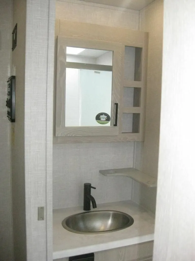 Bathroom sink and medicine cabinet.