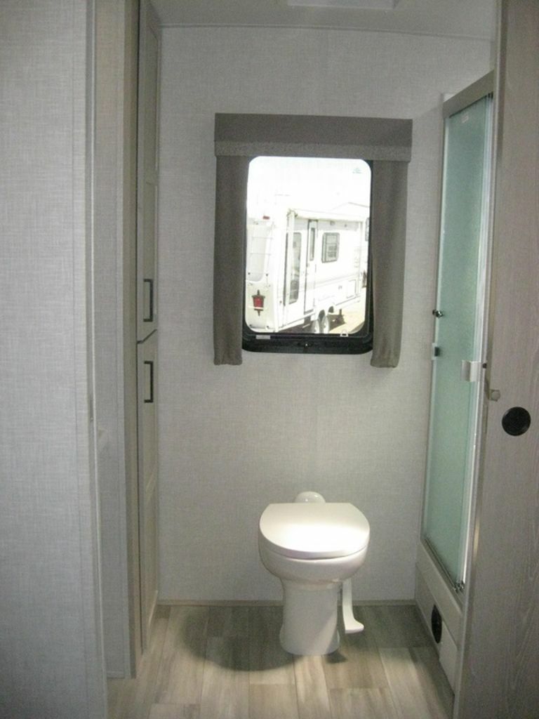 Bathroom with a toilet and a walk-in shower.