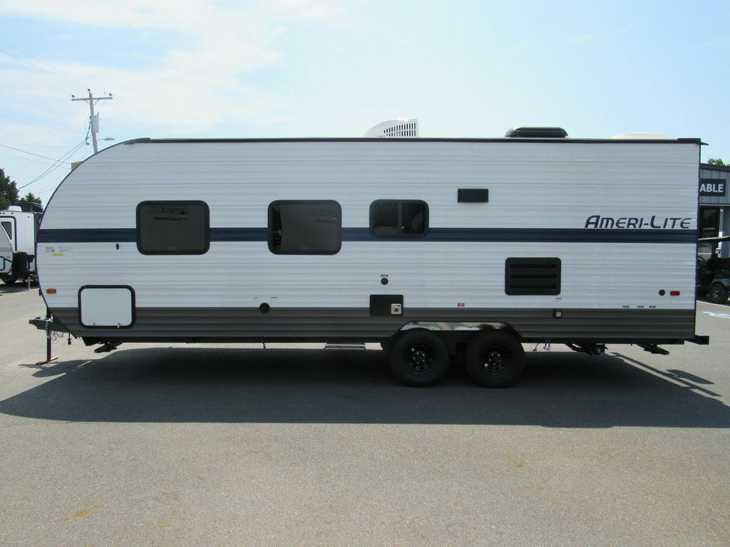 Side view of the New 2022 Gulf Stream Amerilite 241RB Travel Trailer RV.