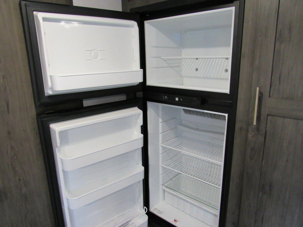 Kitchen with a fridge.