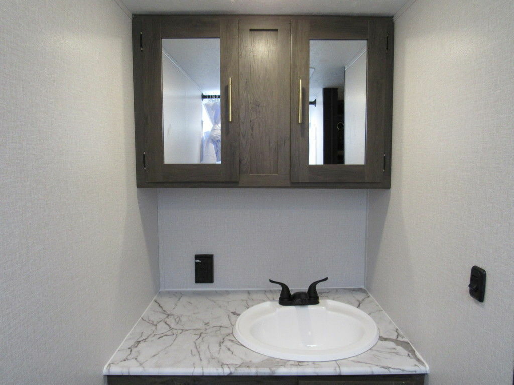 Bathroom with a sink and a medicine cabinet.