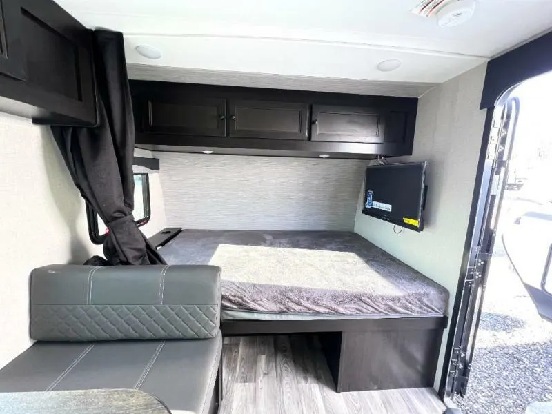 Bedroom with overhead cabinets.