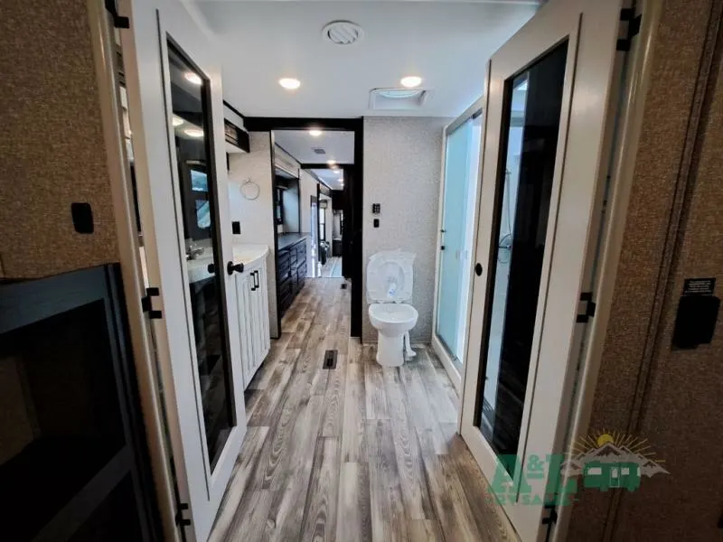 Bathroom with a sink, toilet and a walk-in shower.