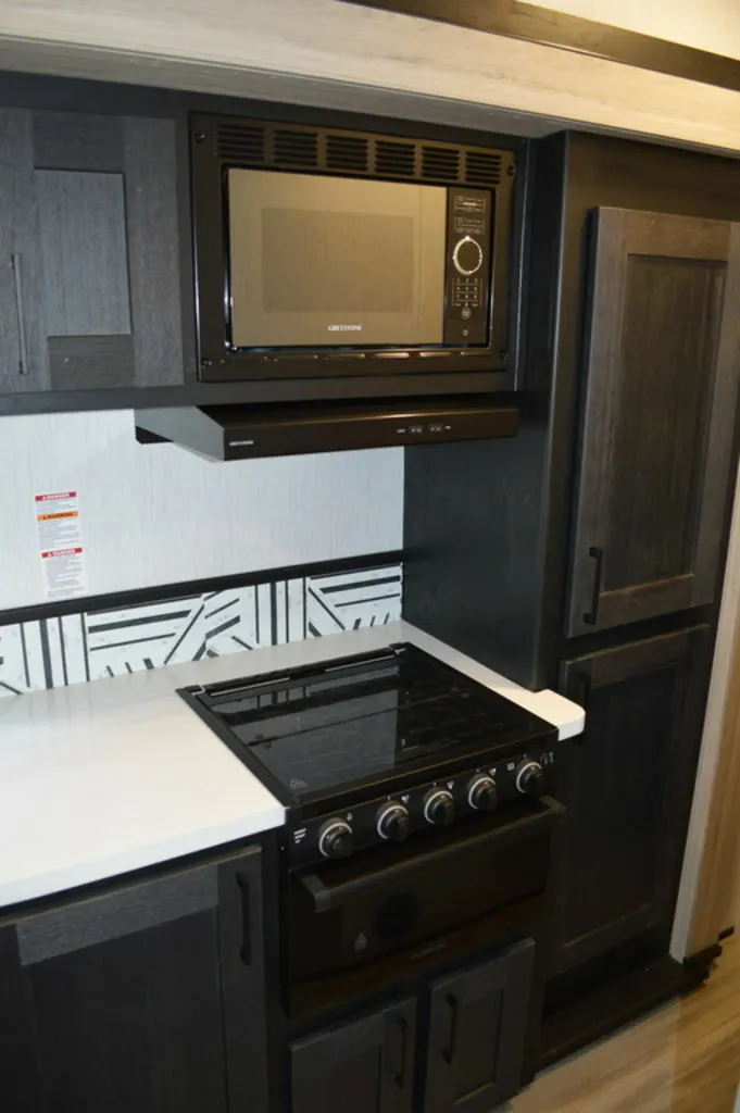 Kitchen with a gas burner, oven, and cabinets.