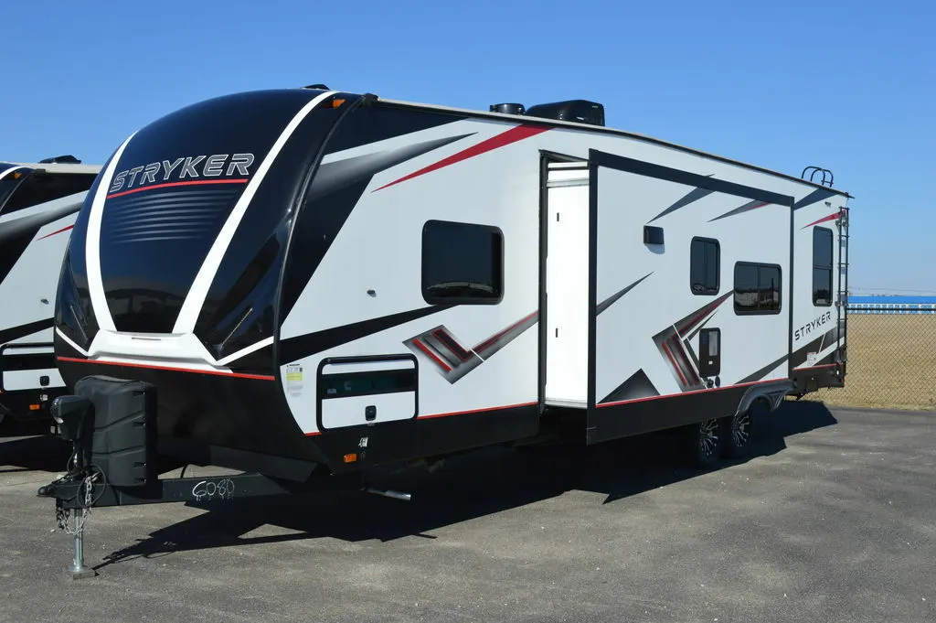 Side view of the New 2022 Cruiser Rv Stryker ST2916 Travel Trailer Toy Hauler RV.