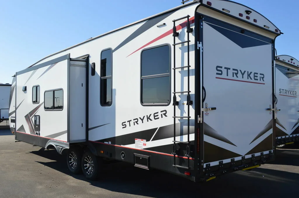 Side view of the New 2022 Cruiser Rv Stryker ST2916 Travel Trailer Toy Hauler RV.