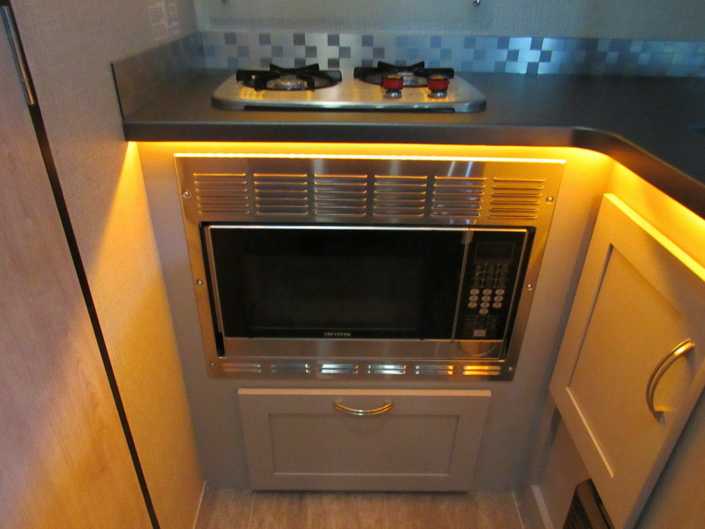 Kitchen with a gas burner, oven, and cabinets.