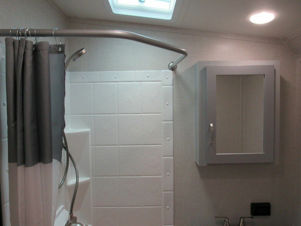 Bathroom with a shower and skylight.