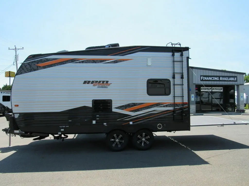 Side view of the New 2022 Chinook Travel Trailer RPM Extreme 18FKLE Toy Hauler RV.