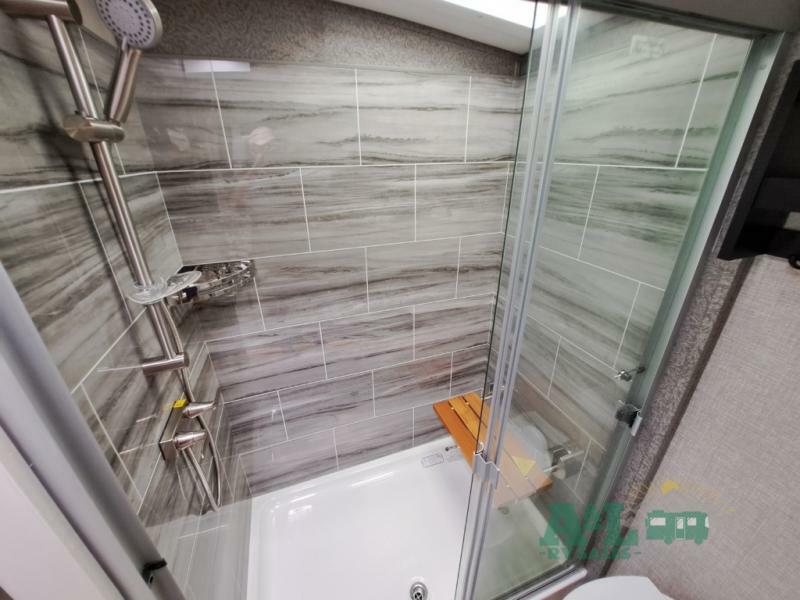 Walk-in shower with skylight.