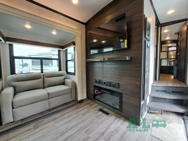 Living space with a TV and a fireplace.