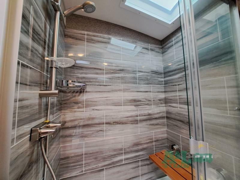 Walk-in shower with skylight