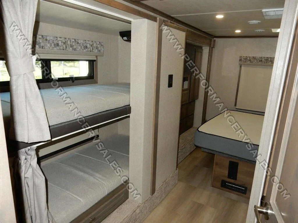 Bedroom with a king size bed and bunks.