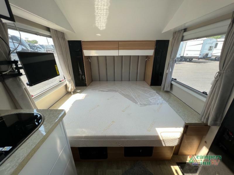 Bedroom with overhead shelf and a shirt closet.