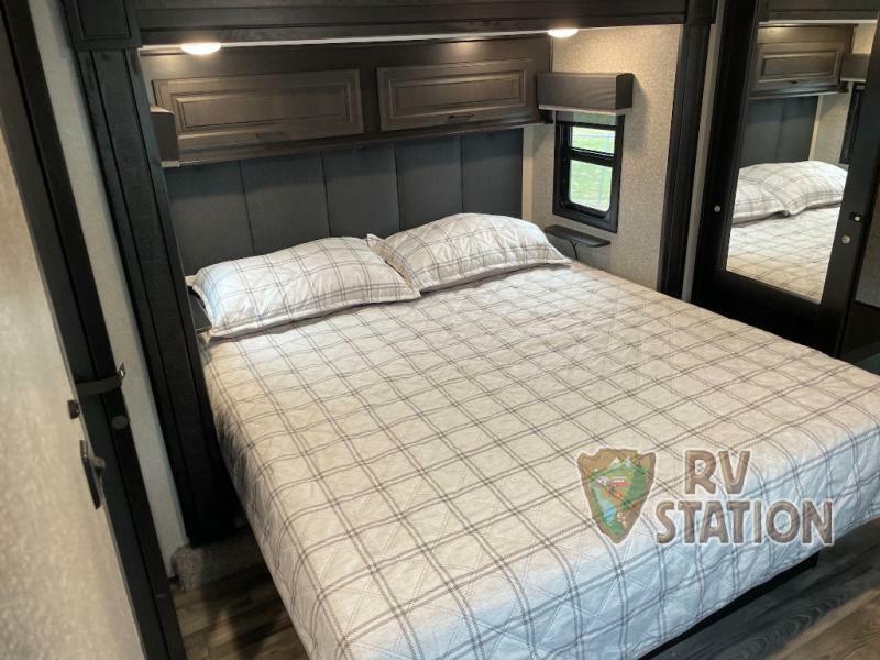 Bedroom with overhead cabinets.