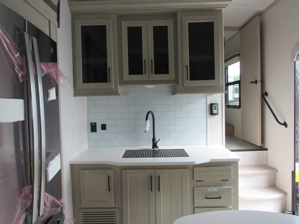 Kitchen with a sink and cabinets.