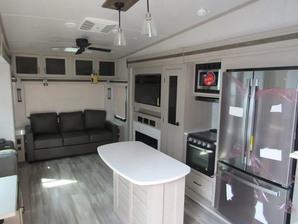 Interior view of the RV with a living space and a kitchen.