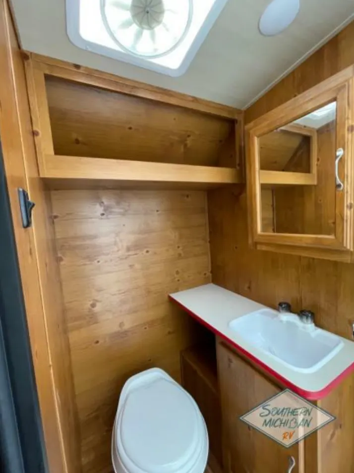 Bathroom with a sink, toilet and a medicine cabinet.