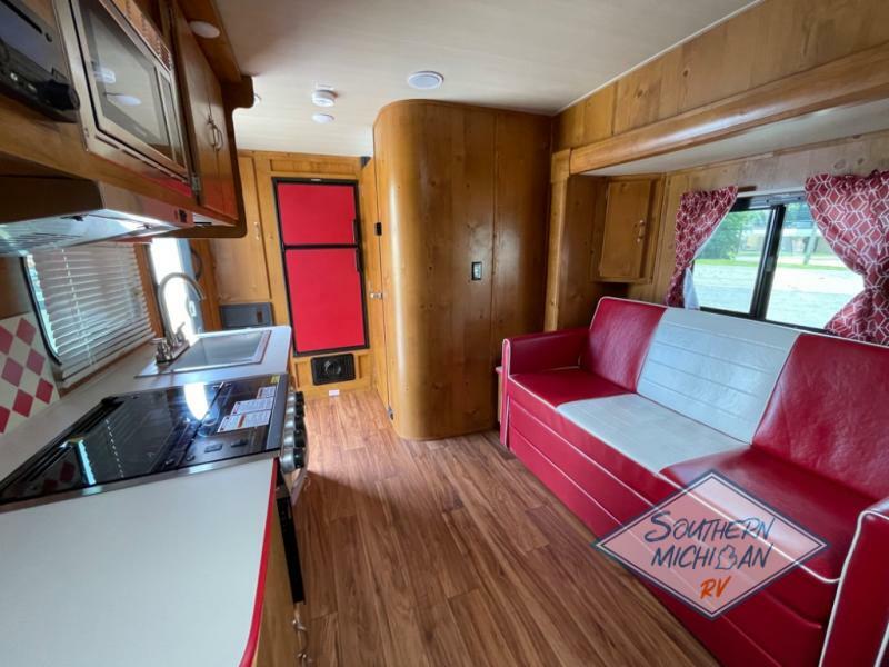 Interior view of the RV with a living space and a kitchen.