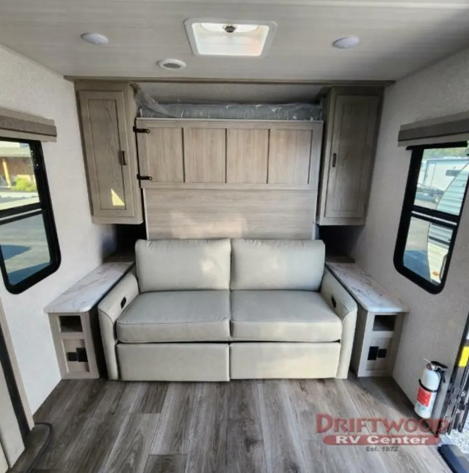 Living space with overhead cabinets.