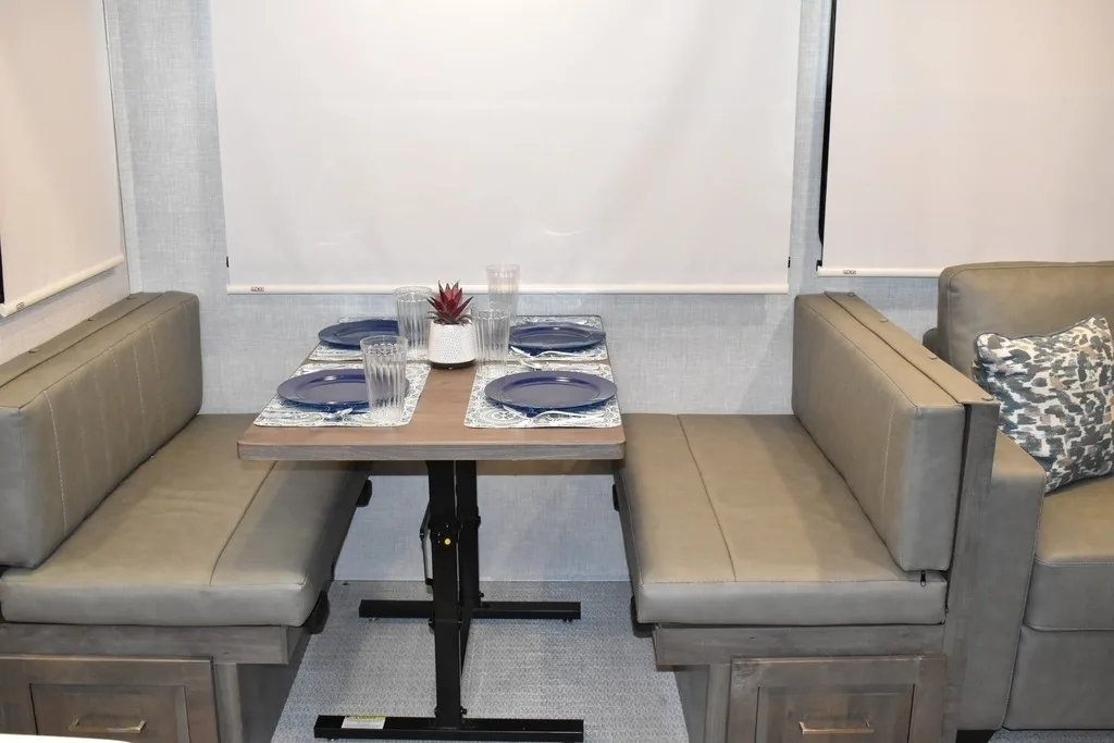 Dinette flanked by leather seats.