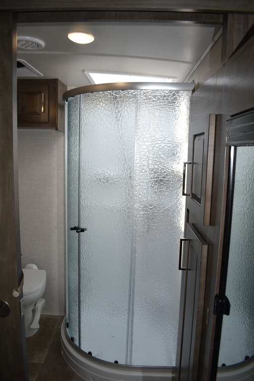 Walk-in shower with skylight.