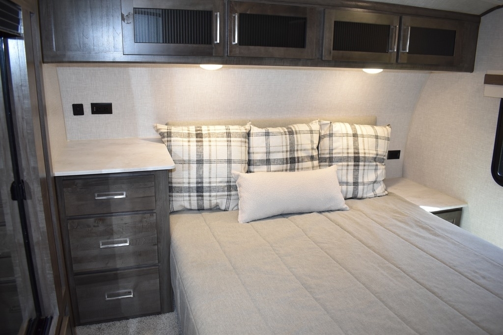 Bedroom with overhead cabinets.