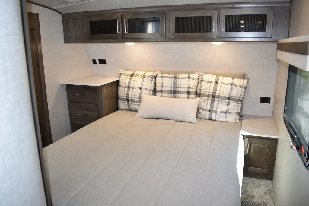 Bedroom with overhead cabinets.