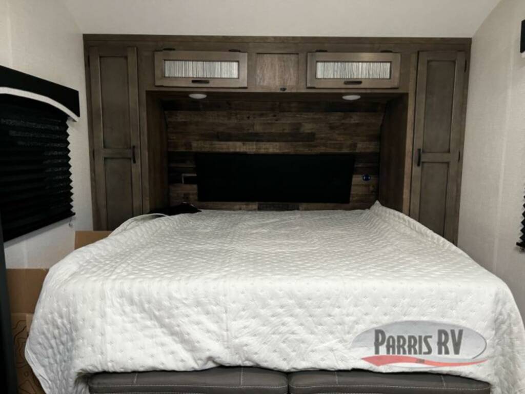 Bedroom with overhead cabinets.