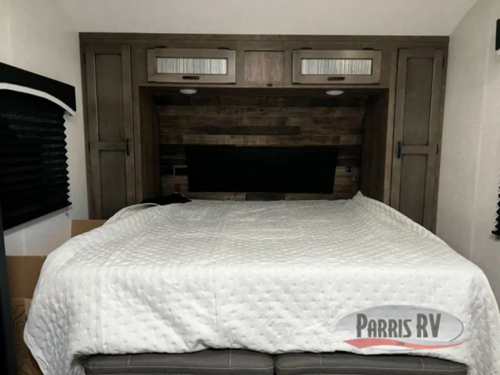 Bedroom with overhead cabinets.