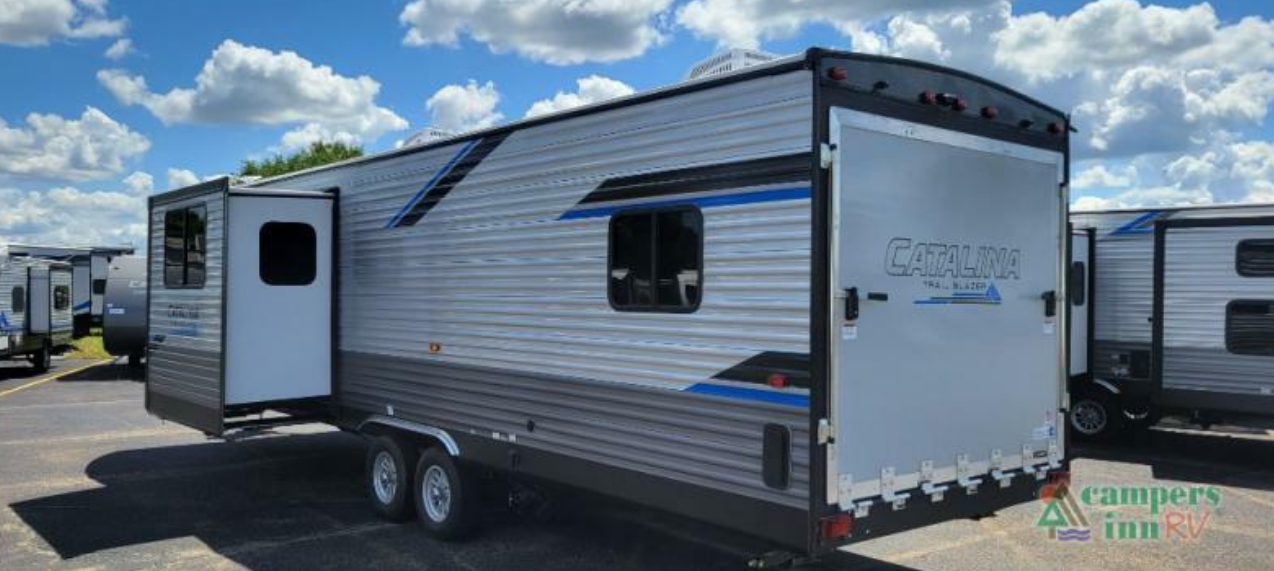 Side view of the New 2022 Coachmen Rv Travel Trailer Catalina Trail Blazer 29THS Toy Hauler RV.