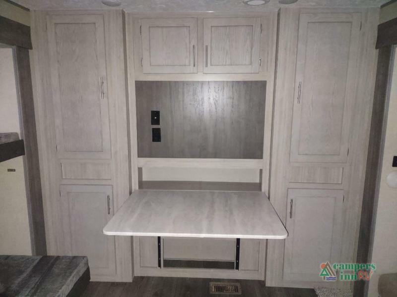 Bedroom with bunks and cabinets.