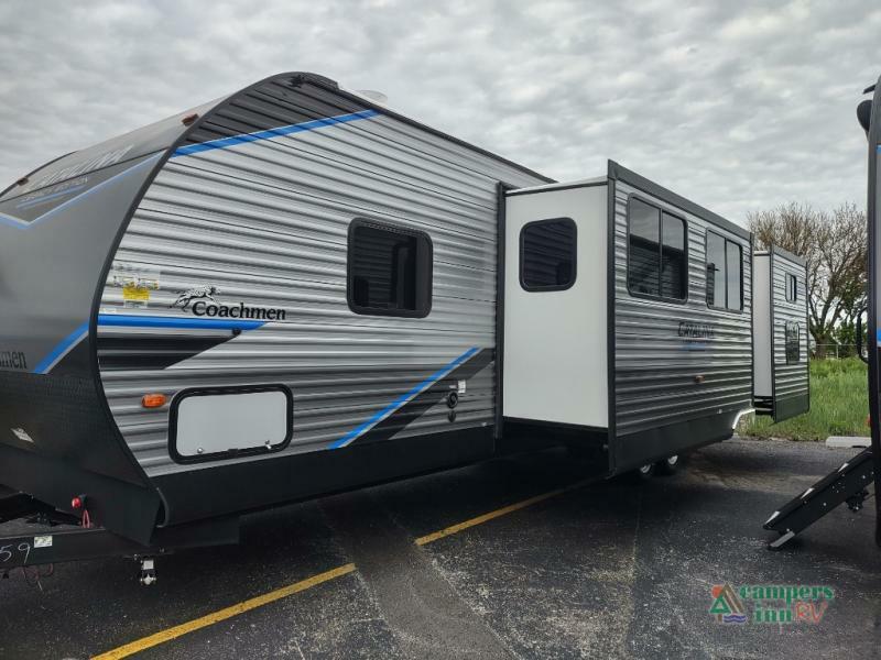 Side view of the New 2022 Coachmen Rv Catalina Legacy 323QBTSCK Travel Trailer RV.