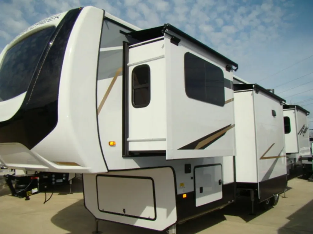 Side view of the New 2022 Forest River Cedar Creek 371FL Fifth Wheel RV.